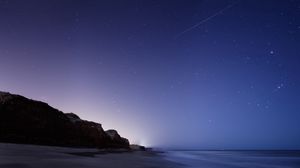 Preview wallpaper stars, night, twilight, the sky, falling, the sea, the rock