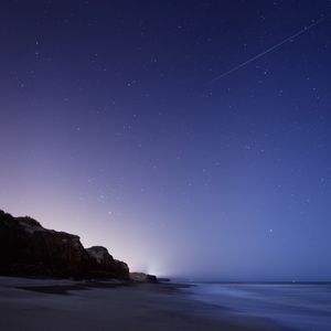 Preview wallpaper stars, night, twilight, the sky, falling, the sea, the rock