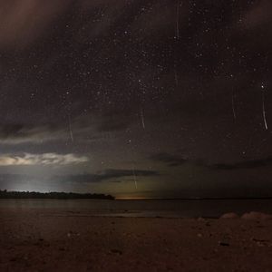 Preview wallpaper stars, starry sky, shore, sea, night, dark