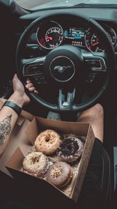 Preview wallpaper steering wheel, machine, hand, donuts, tattoo
