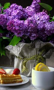 Preview wallpaper still life, flowers, lilac, butterfly, breakfast, waffles, strawberries, cup, lemon, sugar, cloth, dark background