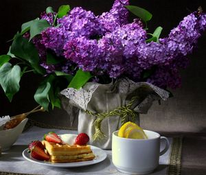 Preview wallpaper still life, flowers, lilac, butterfly, breakfast, waffles, strawberries, cup, lemon, sugar, cloth, dark background