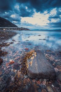 Preview wallpaper stone, pebbles, sea, horizon, sky