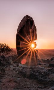 Preview wallpaper stone, rock, sun, sunlight, sunset