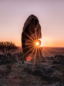 Preview wallpaper stone, rock, sun, sunlight, sunset