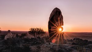Preview wallpaper stone, rock, sun, sunlight, sunset