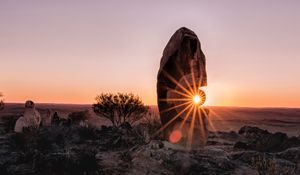 Preview wallpaper stone, rock, sun, sunlight, sunset