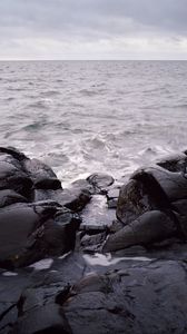 Preview wallpaper stones, boulders, cranny, sea, horizon