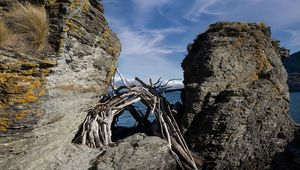 Preview wallpaper stones, branches, logs, sea