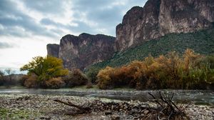 Preview wallpaper stones, branches, river, mountains, nature