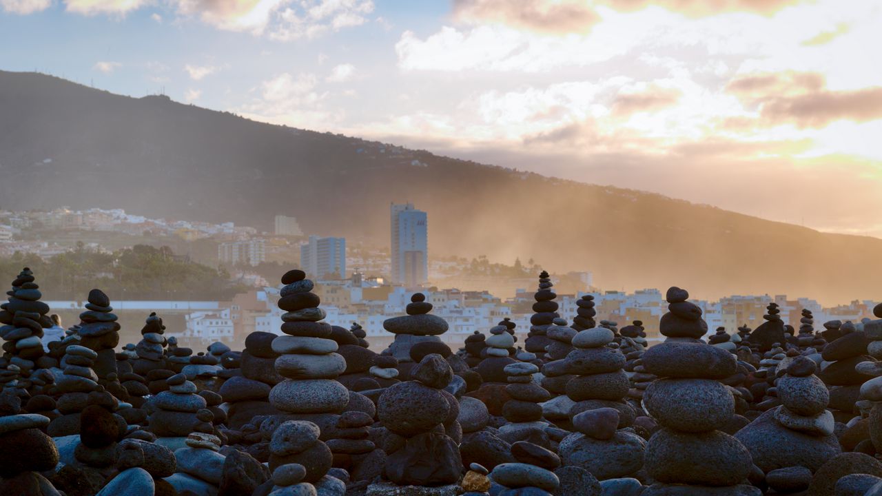 Wallpaper stones, city, mountains, fog, landscape