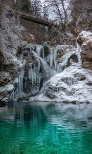 Preview wallpaper stones, cliff, ice, icicles, lake, bridge