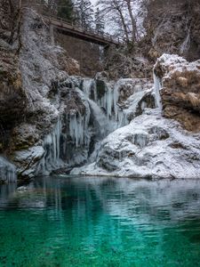 Preview wallpaper stones, cliff, ice, icicles, lake, bridge