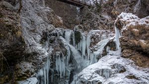 Preview wallpaper stones, cliff, ice, icicles, lake, bridge