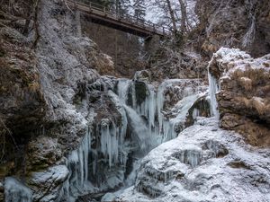 Preview wallpaper stones, cliff, ice, icicles, lake, bridge