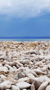 Preview wallpaper stones, coast, beach, figure