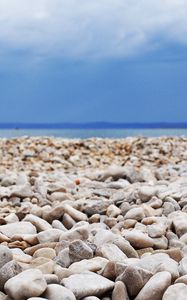 Preview wallpaper stones, coast, beach, figure