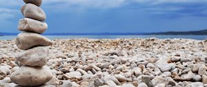 Preview wallpaper stones, coast, beach, figure