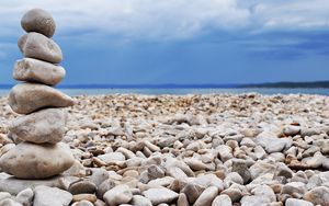 Preview wallpaper stones, coast, beach, figure