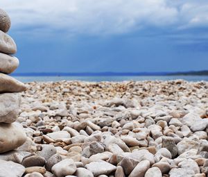 Preview wallpaper stones, coast, beach, figure