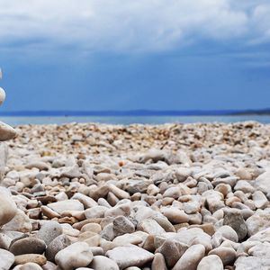 Preview wallpaper stones, coast, beach, figure