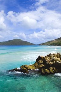 Preview wallpaper stones, coast, blue water, tropics, sky, surf