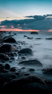 Preview wallpaper stones, coast, fog, horizon, sunset