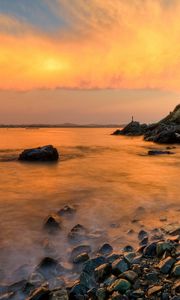 Preview wallpaper stones, coast, fog, rocks, water, decline, evening