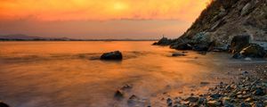 Preview wallpaper stones, coast, fog, rocks, water, decline, evening