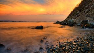 Preview wallpaper stones, coast, fog, rocks, water, decline, evening