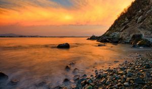 Preview wallpaper stones, coast, fog, rocks, water, decline, evening