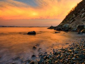 Preview wallpaper stones, coast, fog, rocks, water, decline, evening