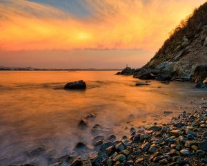 Preview wallpaper stones, coast, fog, rocks, water, decline, evening