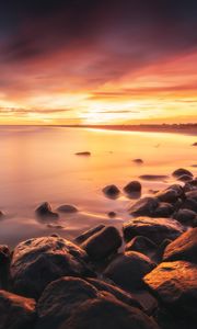 Preview wallpaper stones, coast, horizon, sunset