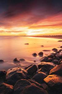 Preview wallpaper stones, coast, horizon, sunset