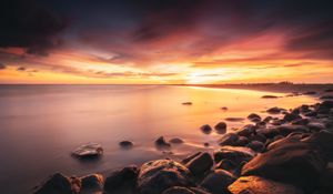 Preview wallpaper stones, coast, horizon, sunset