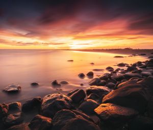 Preview wallpaper stones, coast, horizon, sunset