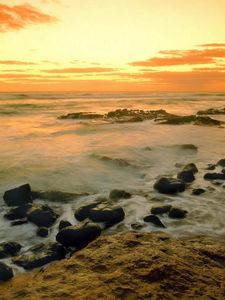 Preview wallpaper stones, coast, sea, wave, evening, sky, emptiness