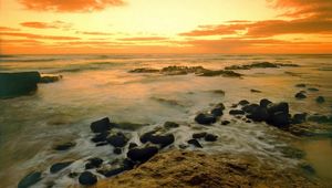 Preview wallpaper stones, coast, sea, wave, evening, sky, emptiness