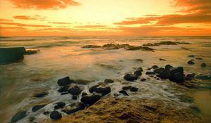 Preview wallpaper stones, coast, sea, wave, evening, sky, emptiness