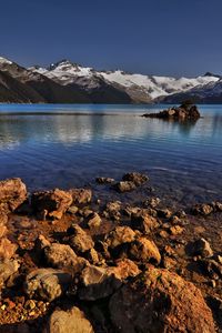 Preview wallpaper stones, coast, water, lake, transparent, mountains