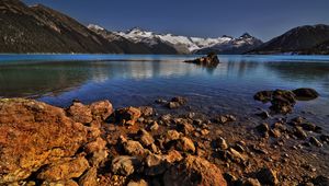 Preview wallpaper stones, coast, water, lake, transparent, mountains