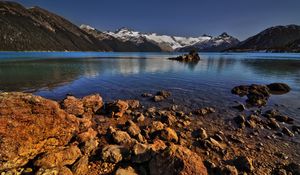 Preview wallpaper stones, coast, water, lake, transparent, mountains