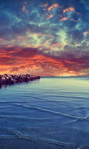 Preview wallpaper stones, construction, sea, breakwater, water, bottom, stains, small, clouds, evening, decline, horizon