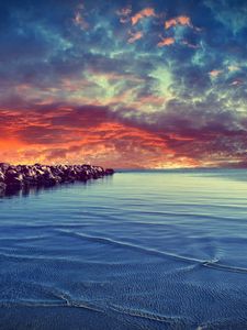 Preview wallpaper stones, construction, sea, breakwater, water, bottom, stains, small, clouds, evening, decline, horizon