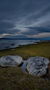 Preview wallpaper stones, grass, shore, sea, twilight