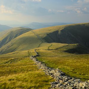 Preview wallpaper stones, hills, grass, lines, landscape