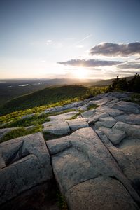 Preview wallpaper stones, hills, rays, sun