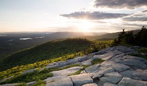 Preview wallpaper stones, hills, rays, sun