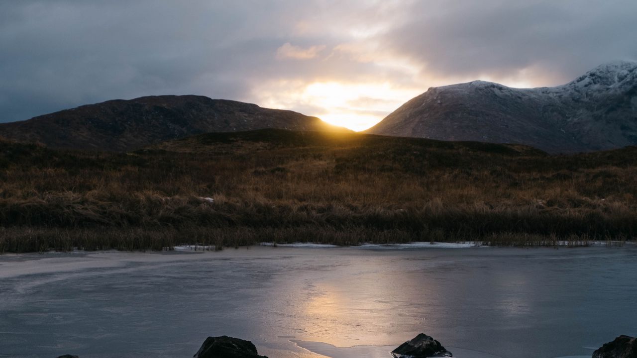 Wallpaper stones, lake, grass, hills, sunset